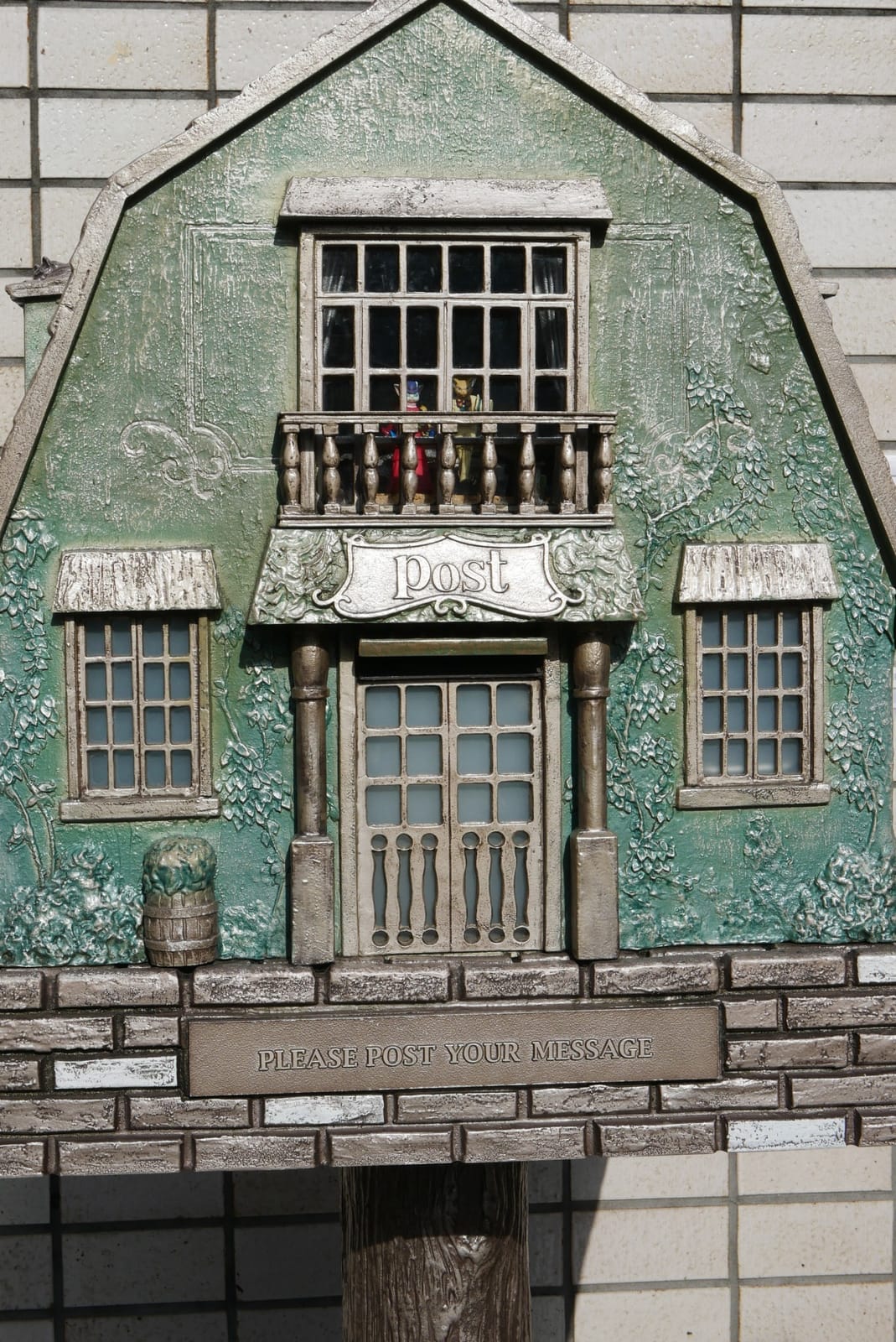 The Youth Post from the front: a small green house with a balcony and a "post" sign
